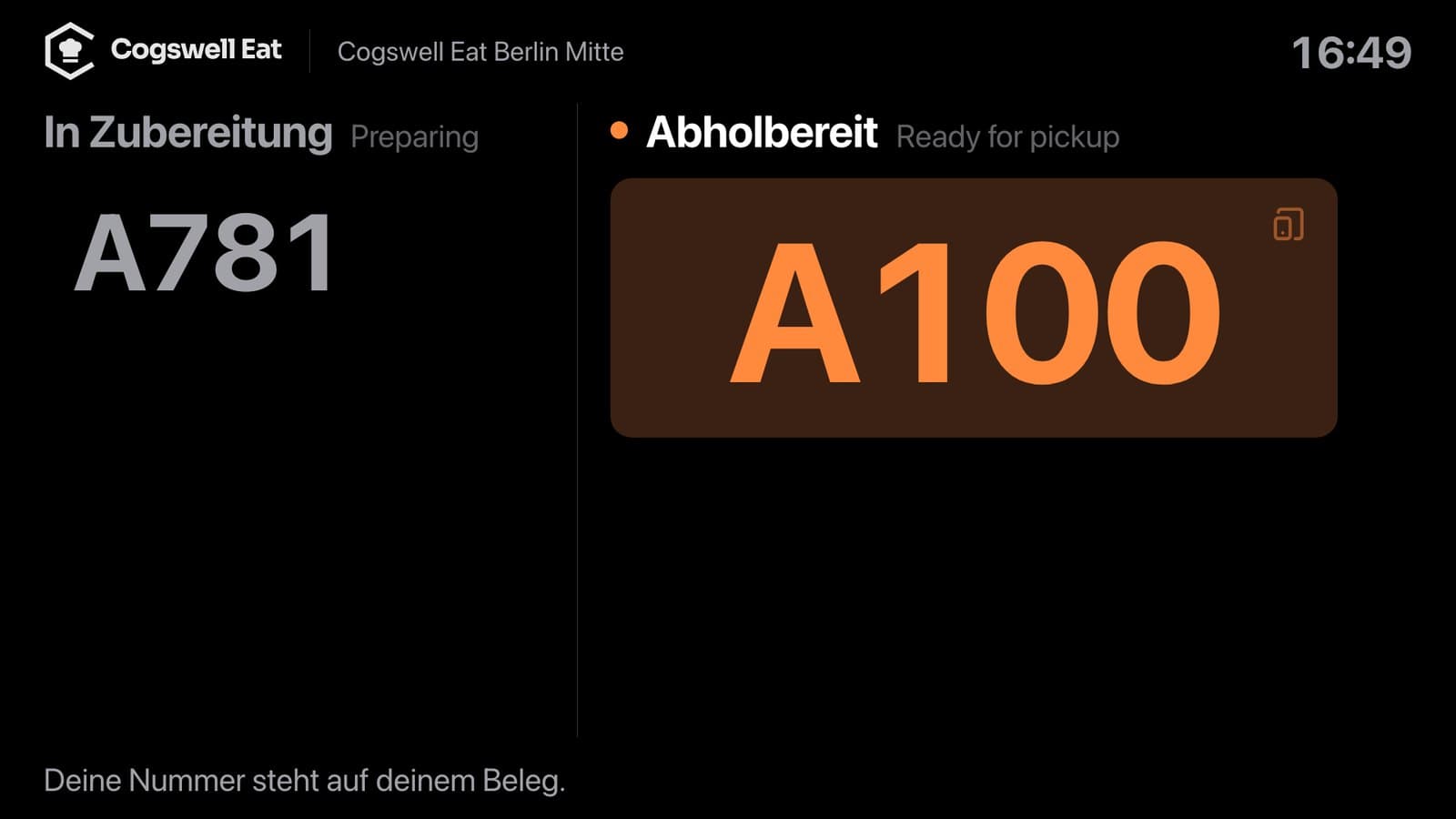 Abholanzeige im Laden: A100 groß unter „Abholbereit“, links „In Zubereitung“ mit A781