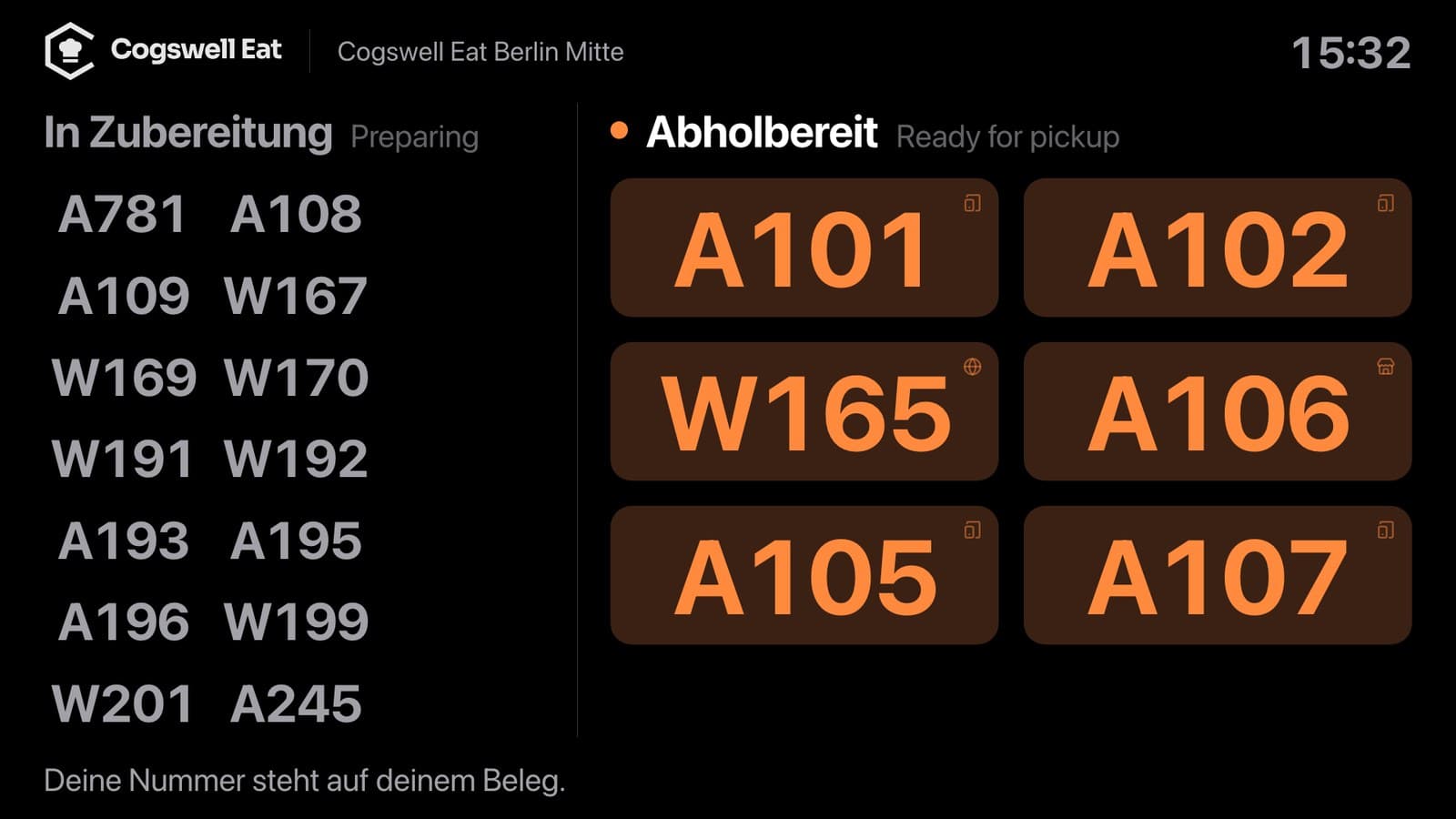 Abholanzeige im Laden: links „In Zubereitung“ mit Nummern aus Kiosk und Online, rechts „Abholbereit“ mit A101, A102, W165 und weiteren Nummern in Orange